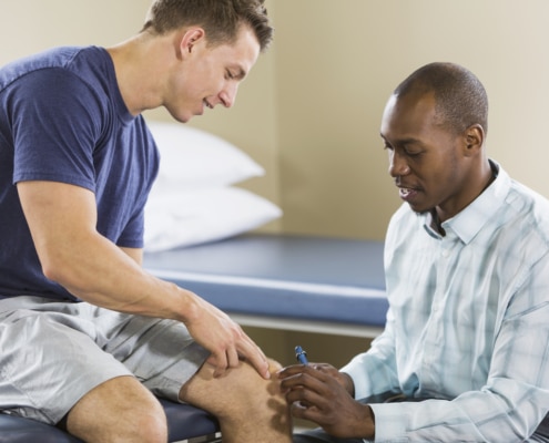 Physical therapist examining patient - Colorado Center of Orthopaedic Excellence Physical therapist examining patient