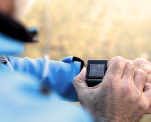 Elderly Man using Smart Watch measuring heart rate - Colorado Center of Orthopaedic Excellence technology in orthopedics